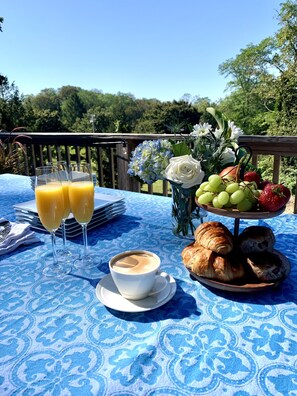 Enjoy breakfast outdoors on front deck with the beautiful garden views