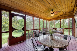 Relaxing on the screened-porch is the best place to enjoy your morning coffee or evening beverage!