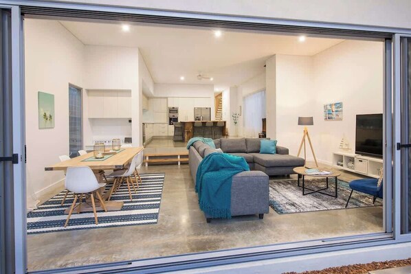 From Yard to lounge/ kitchen area