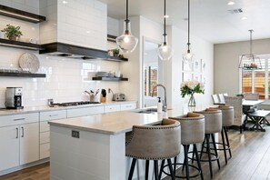 Modern and clean kitchen with barstool seating for 4 people