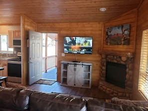 Family room with flat screen TV (direct tv) propane fireplace.  Queen sofa sleep