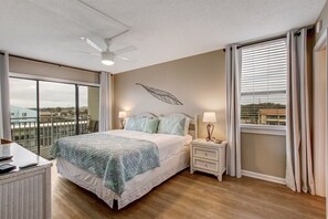 Primary Bedroom with King Bed and Access to Balcony