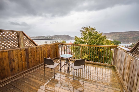 View Signal Hill, the narrows, the ocean, and the city from your private patio.