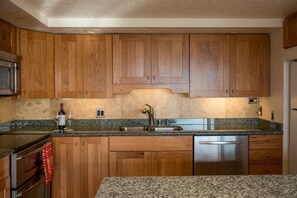 Hickory cabinets, Granite counters, and Stainless Appliances in kitchen