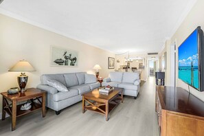 The open concept main living area features comfortable and inviting furnishings - perfect for relaxing.