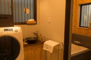 A washing machine, bath and toilet are available in each room.