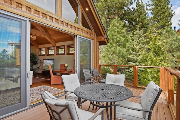Outdoor deck with gas BBQ grill and outdoor seating