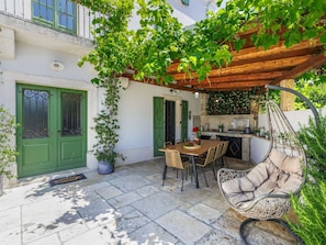 Furniture, Outdoor Furniture, Chair, Door, Outdoor Table, Flowerpot, Garden, Kitchen & Dining Room Table, Shade, Houseplant
