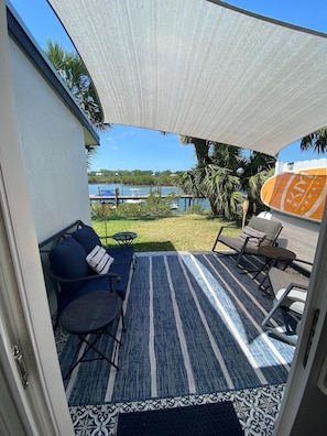 View from Kitchen sliders onto patio and river
