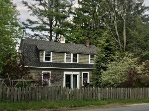 Exterior, from the approach on Sams Point Road.