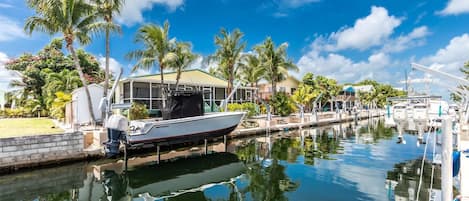 Experience the charm of canal front living with swift access to open waters (Please note: boat not included).