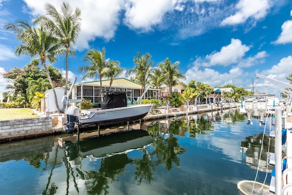 Experience the charm of canal front living with swift access to open waters (Please note: boat not included).