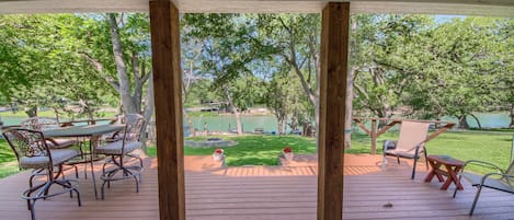 Beautiful view of the backyard, with a nice deck seating area.