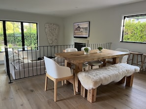 Indoor dining, adjacent to open kitchen and flipout window/bar