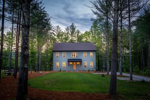 The color of the house changes as the day evolves, from brown to blue hues.