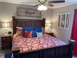 Master bedroom with a king sized bed and Smart TV 