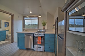 Kitchen showing dishwasher, oven and sink