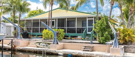 Experience canal front living with space for your boat (Please note: davits are not available for guest use).