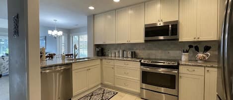 Beautiful updated kitchen with all new appliances and granite countertops