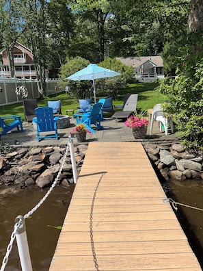 Lake front slate patio with fire pit.