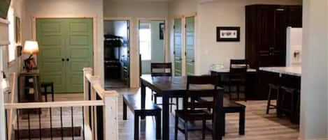 dining area with master bedroom & 2nd bedroom in background