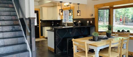 Kitchen/Dining Room and stairs leading to second floor. 