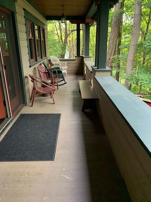 Additional porch to enjoy the wooded setting with your morning coffee.