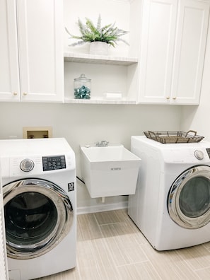 Full size washer and dryer with large utility sink