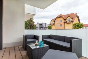 Spacious balcony with garden furniture. The location is perfect for enjoying your morning coffee in the fresh air. 