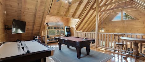 Upstairs game room with twin bunk beds