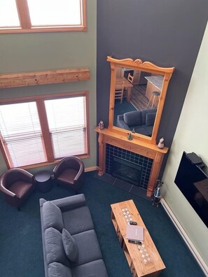 A 65-inch TV with a cosy fireplace too.