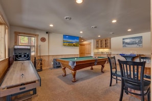 Recreation area with pool table, bubble hockey, Skee-ball, and poker table