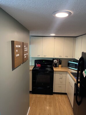 kitchen, adjacent to main living area