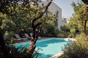 Escape to a tranquil Cretan paradise surrounded by blooming gardens.