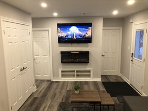 Living room comes with 4K TV and Heat Generating fireplace to keep you comfy.  