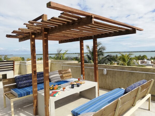 Endless Ocean and Mountain views with a communal dining area & Giant sunbeds 