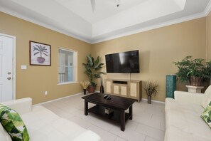 Spacious Living Area surrounds a Flat Screen TV