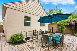 Elegant back patio shared with neighboring apartment.