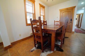 Sit down at the dining room table for food, games, or conversation!