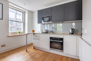 The kitchen is fully equipped to prepare a simple meal