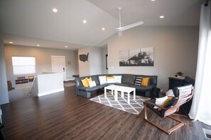 Living room w/ glorious natural light & Italian leather couch to enjoy mtn views