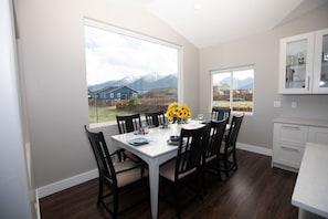 Dining room seats 8, features vaulted ceiling, huge 6x8ft window w/ big mtn view