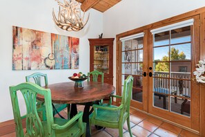 Dining room with access to balcony. Great spot for work-at-home activities.