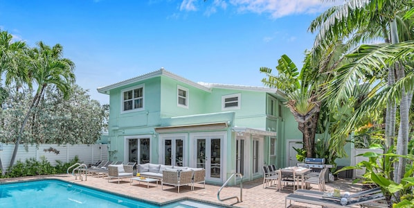 Steps away from the beach.  Classic coastal Florida residence with a heated pool.