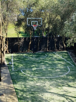 Private fully fenced basketball court
