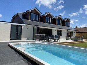 Back of property with Hydropool Swim Spa (Heated Pool/Hot Tub)