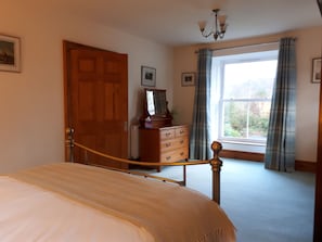 Bedroom with views of the convent woods at the rear of the building.