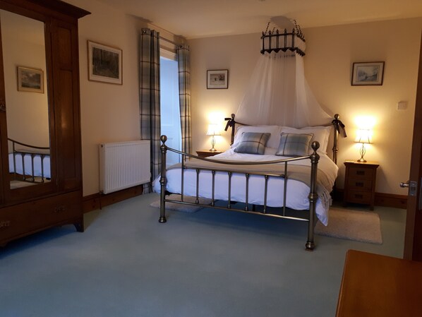 Very spacious bedroom with kingsize bed overlooking the garden and convent woods