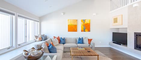 Light filled, open living room with views of Wonderland Lake.