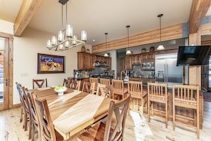 Formal dining area with additional barstool seating for up to 6 guests